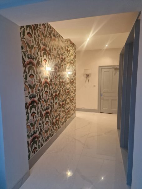 Painted hallway with wallpaper feature wall